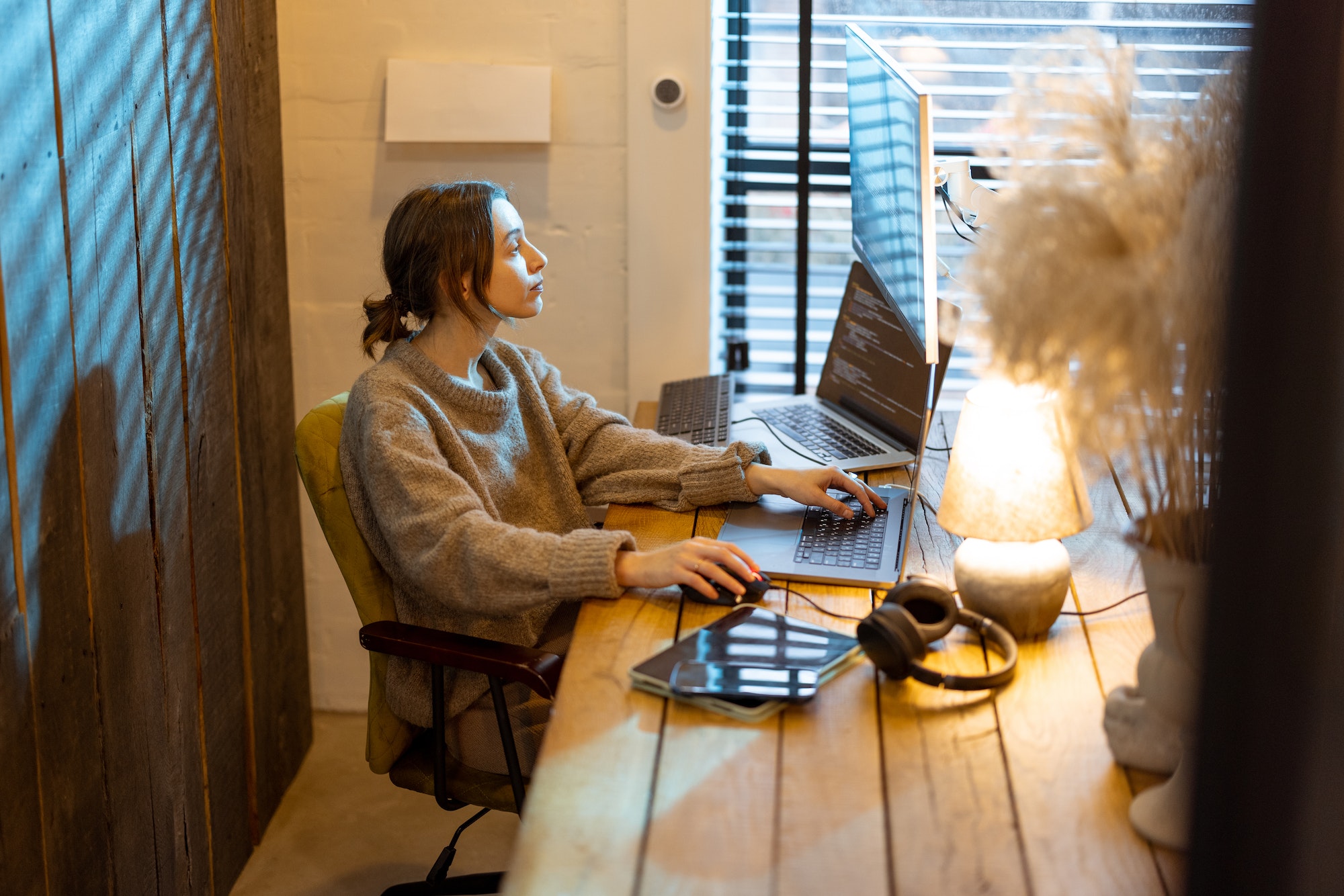 Woman works from cozy home office