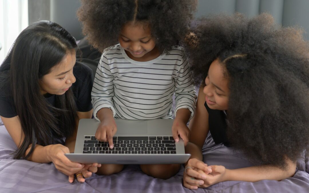 Asian-African American family Use a laptop to surf the Internet